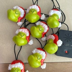 Christmas Santa the Grinch singing stringing lights